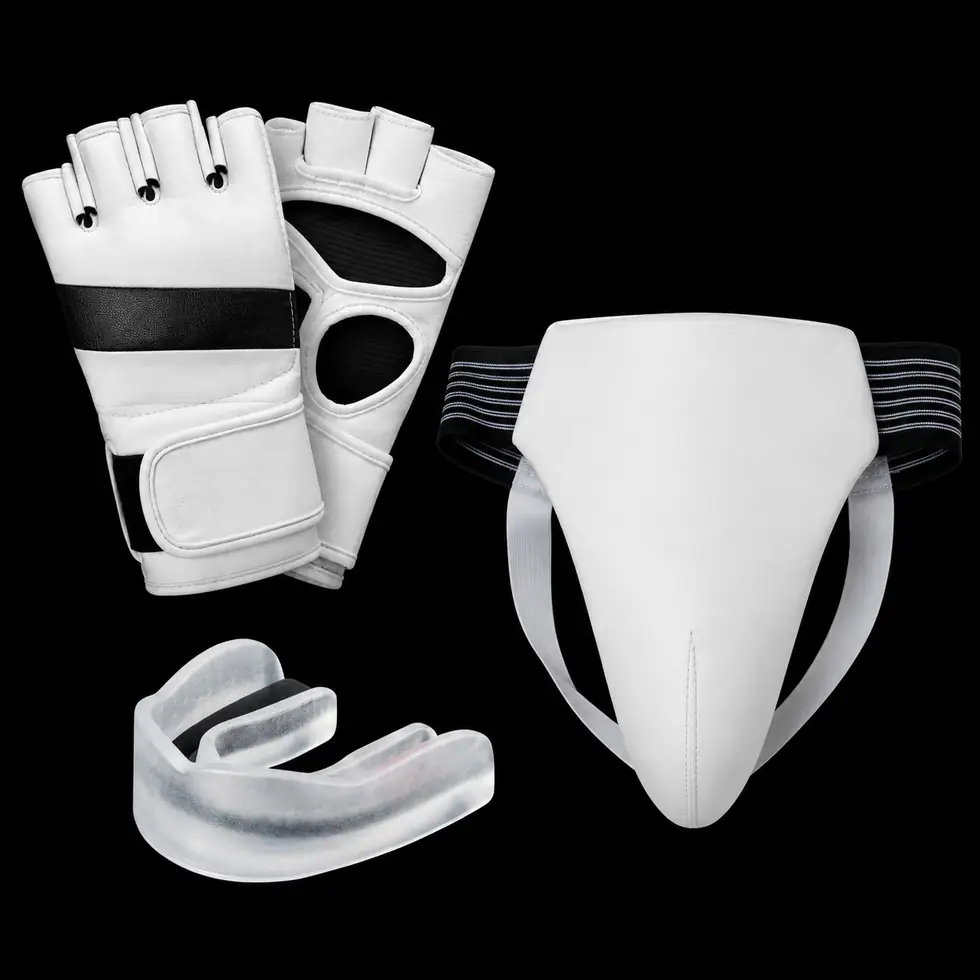 White MMA gloves, mouth guard, and groin protector on a black background